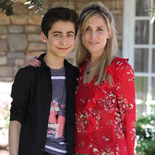 Aidan Gallagher with his mother