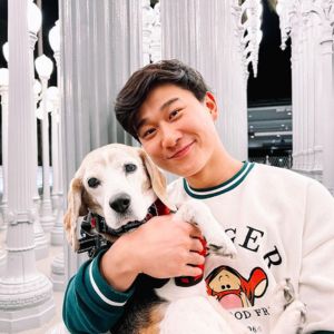 Sam Song Li With his pet dog Image